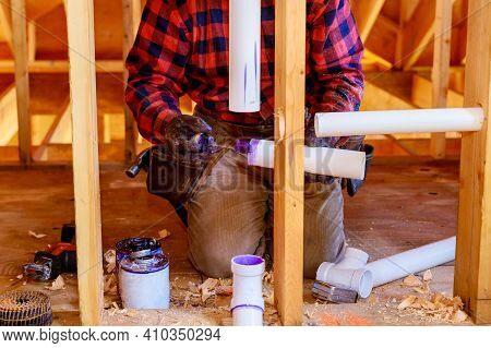 Plumbing Building Contractor Installing Plastic Drain Pipe In The Elbow For Sink Drain For A Custom 