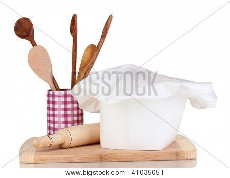 Kochmütze mit Löffel und Federballschläger, isolated on white