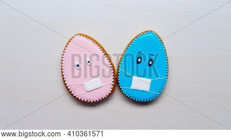 Pandemic Composition. Easter Holiday. Social Distancing. Festive Pastry Decoration. Pink Blue Ginger