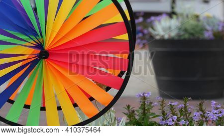 Colorful Pinwheel Spinning, Weather Wind Vane, Garden Decoration In Usa. Rainbow Symbol Of Childhood