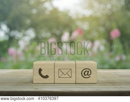 Telephone, Mail, Email Address Icon On Wood Block Cubes On Wooden Table Over Blur Pink Flower And Tr