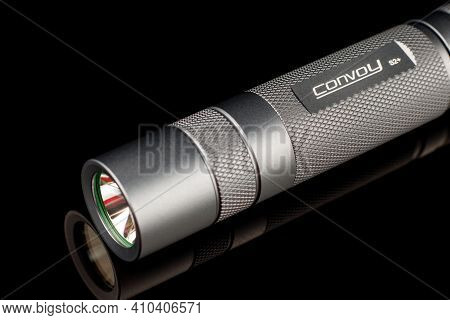 Lviv, Ukraine - February 24, 2021: Convoy S2+ Flashlight Close-up