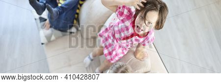 Children Play And Jump On Couch And Have Fun. How To Teach Child To Manage Emotions Concept