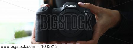 Minsk, Belarus - July 31 2020 : Woman Holding A Camera Canon Eos R5 Closeup. Illustrative Editorial.