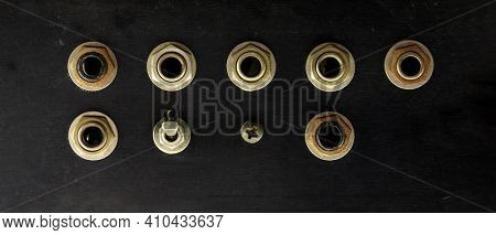 Blank vintage input output jacks or sockets. Black brushed metal surface with rusted or old phone jack sockets and toggle switch mounted. 