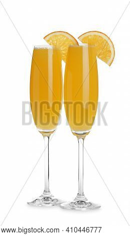 Fresh Alcoholic Mimosa Cocktails With Orange Slices On White Background