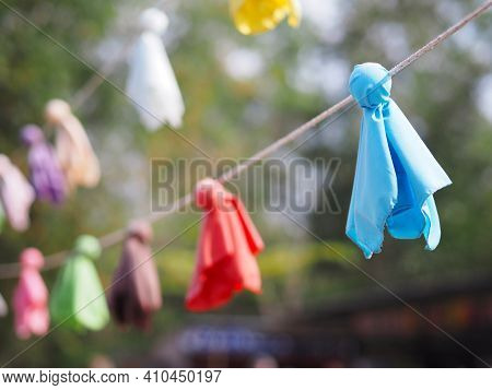 Close Up Japanese Fabric Rain Doll Or Teru Teru Bouzu Hanging In Row At Japan Garden.