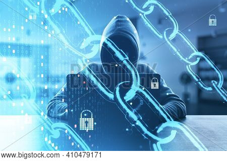 Internet Security And Data Protection Concept With Noface Hacker With Laptop And Digital Screen With
