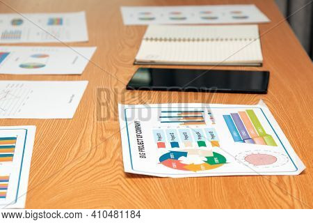 Close Up Sample Project Report Together With Other Chart And Tablet For Presentaion On Desk In Offic