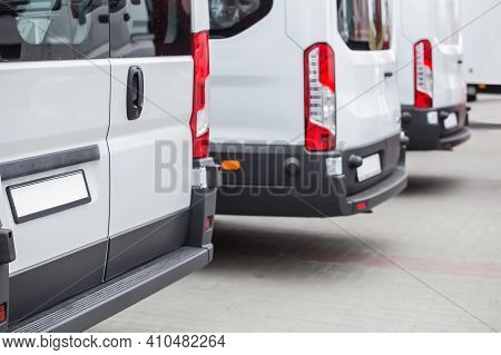 Minibuses In The Parking Lot At The Bus Stop. Back View.