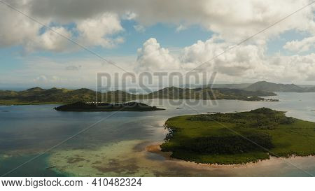 Tropical Island Covered With Forest Surrounded By An Atoll And A Coral Reef. Bucas Grande, Philippin