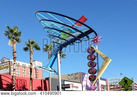 LAS VEGAS - DEC 7, 2017: The giant neon Martini Glass and Vegas signs that hang above Freemont Street in downtown Las Vegas.
