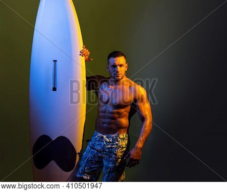 Surfboard Man With Serf Board. Surfer With A Surfboard. Sexy Man Wet All Over Body Holding Serf Boar