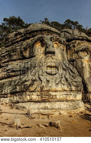 Two Giant Heads Of Devils Carved Into Sandstone Rocks,each Is About 9m High.devils Heads Created By 