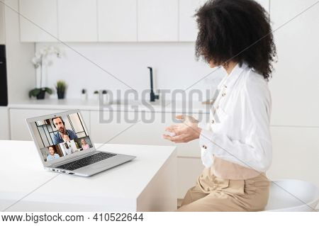 Team Of Coworkers Involved In Webcam Video Conference Call, Led By Mature Male Ceo, Brainstorming, R