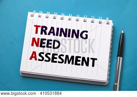 Training Need Assesment, Text Words Typography Written On Paper Against On Blue Background, Life And