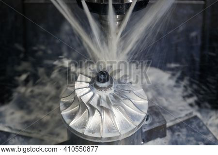 Turbine Wheel Milling Process With Coolant On Five Axis Cnc Machining Center.