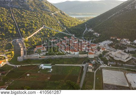 Aerial Drone Shot Of Ston City Wall With Salt Pan In Ragusa Near Dubrovnik In Croatia Summer Morning