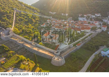 Aerial Drone Shot Of Ston City Wall Over Hill In Ragusa Region Near Dubrovnik In Croatia Summer Sunr