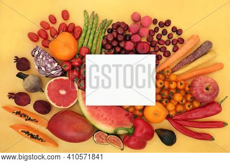 Healthy fruit and vegetables high in lycopene that can lower the risk of certain types of cancer also high in anthocyanins, antioxidants, vitamins, minerals and dietary fibre. On mottled yellow.  