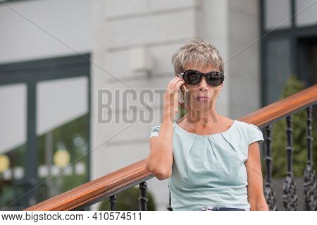 Fashion Business Senior Woman With Phone In Blue Dress City