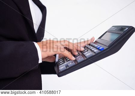 Cropped Hand Business Woman With Black Suit Holding Caculator On White Background.  Business Or Fina
