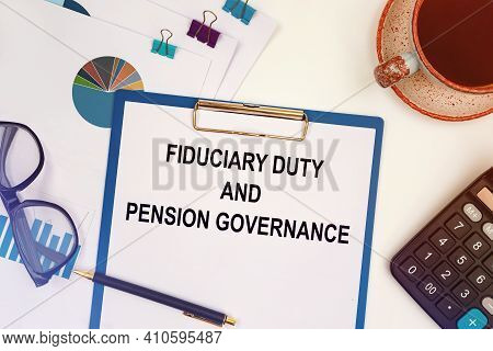 Paper With Text - Fiduciary Duty And Pension Governance On The Office Table, Calculator And Cup Of C