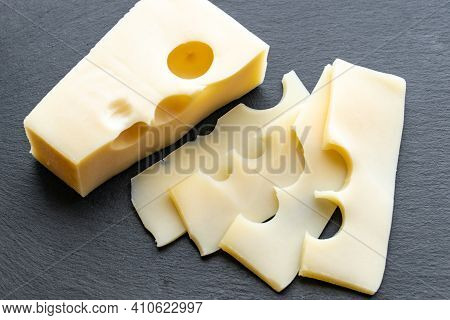 Gouda Cheese On Gray Background. Gouda Cheese Slices