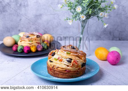 Craffin (cruffin) With Raisins, Nuts And Candied Fruits. Easter Bread Kulich And Painted Eggs. Easte