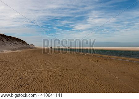 Walking On The North Sea Beach On A Sunny Winter Day Near The Slufter Valley On The Wadden Island Of