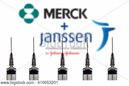 Kathmandu, Nepal - March 2 2021: Syringe Or Injection Placed Against Merck And Janssen Logo On A Com