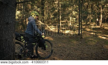 The Woman Travel On Mixed Terrain Cycle Touring With Bike Bikepacking. The Traveler Journey With Bic