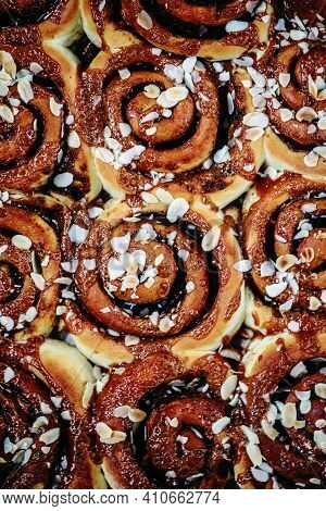 Brunost Caramel Cinnamon Buns A Wooden Table . Dark Rustic Photo.selective Focus