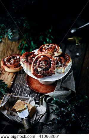 Brunost Caramel Cinnamon Buns A Wooden Table . Dark Rustic Photo.selective Focus