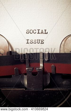 Social issue phrase written with a typewriter.