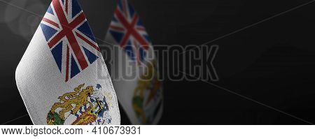 Small National Flags Of The British Antarctic Territory On A Dark Background