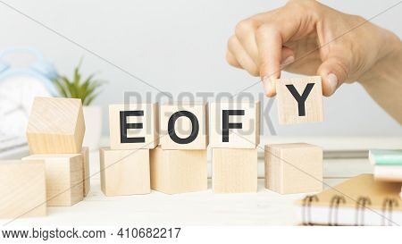 Eofy, End Of Financial Year Text. Wood Cubes And White Background