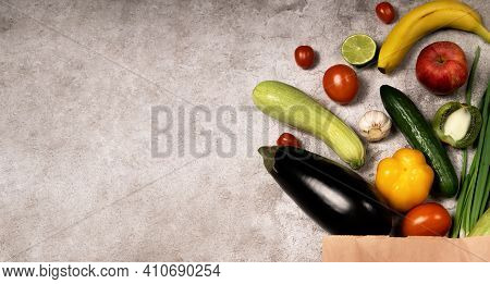 Healthy Lifestyle And Food Concept. Vegetables And Fruits Falling Out From Paper Pocket, Cucumber, T