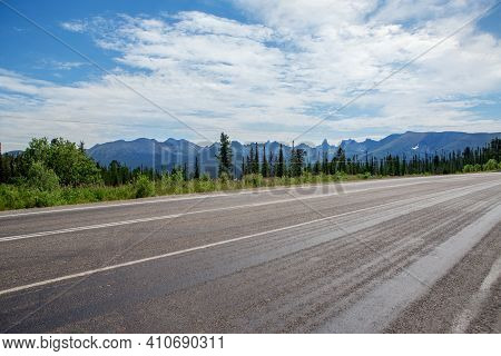 Photo From The Car Window While Traveling In The Altai Republic In The Summer Season. High Mountains