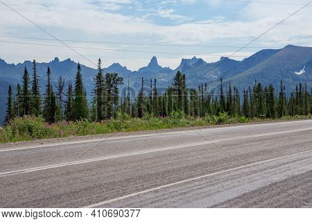 Photo From The Car Window While Traveling In The Altai Republic In The Summer Season. High Mountains