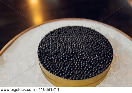 Paddlefish Black Caviar In A Plastic Plate, Gourmet And Delicious Food, Close Up.