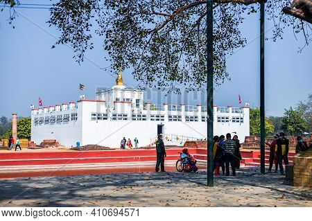 Lumbini, Nepal - February 23 2021: Holy Maya Devi Temple In Lumbini, Nepal. Sacred Pilgrimage Site F