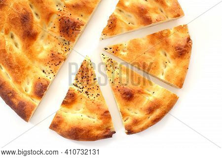 Slices Of Ramadan Pita (ramazan Pidesi) Traditional Turkish Bread For Holy Month Ramadan On White Ba