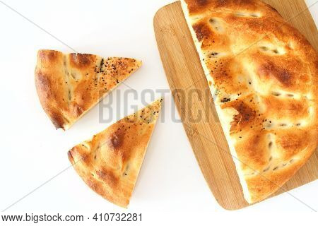Slices Of Ramadan Pita (ramazan Pidesi) Traditional Turkish Bread For Holy Month Ramadan On White Ba