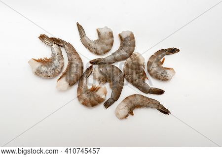 Raw Prawns Isolated On White Background. Top View.