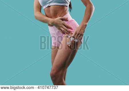 Body Care And Beauty Concept. Closeup Of Young Mucular Aesthetic Body Of A Fit Sporty Woman Massagin
