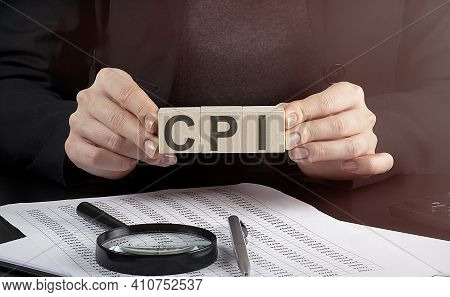 Businesswoman Holding Wooden Block With Text Cpi , Business