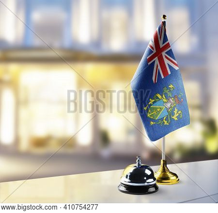 Pitcairn Islands Flag On The Reception Desk In The Lobby Of The Hotel