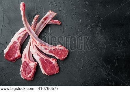 Raw Fresh Lamb Loin Chops Set, On Black Stone Background, Top View Flat Lay , With Copyspace  And Sp