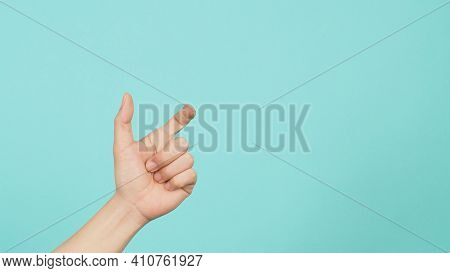 Empty Hand Holding Or Catch Nothing Guesture On Green And Blue Or Mint Background.